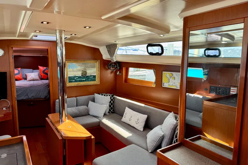 Slide: The Image of Luxurious interior of 2019 Beneteau Oceanis 41.1 yacht with cozy seating and elegant decor. - 31