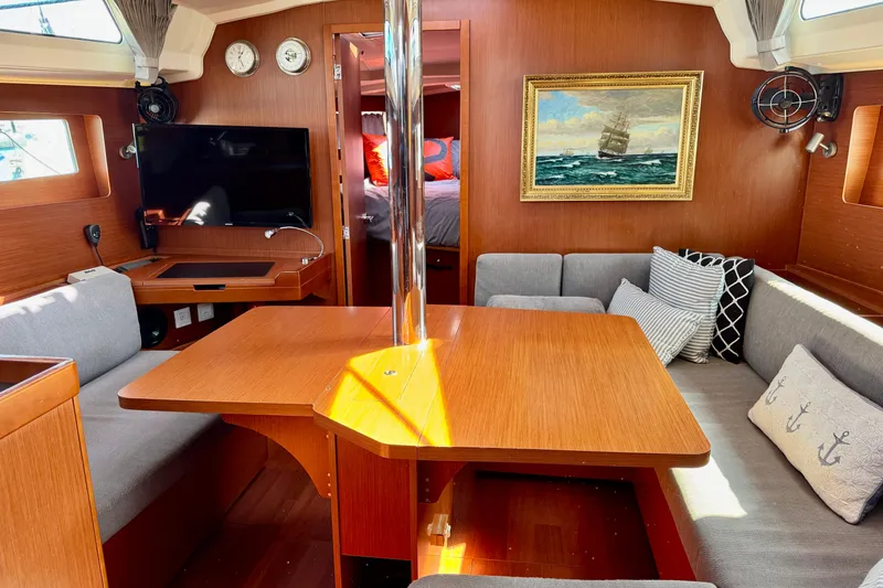 Slide: The Image of Interior of 2019 Beneteau Oceanis 41.1 yacht with cozy seating and nautical decor. - 38