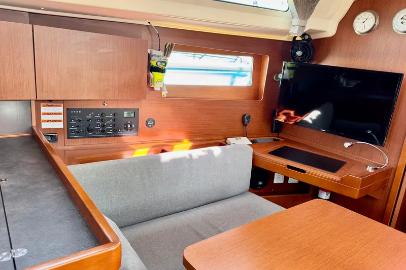 Slide: The Image of Interior of 2019 Beneteau Oceanis 41.1 yacht with modern navigation panel and cozy seating. - 39