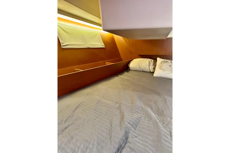 Slide: The Image of Cozy cabin interior of 2019 Beneteau Oceanis 41.1 with comfortable bedding. - 51