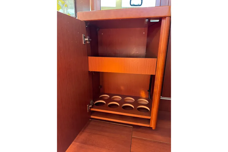 Slide: The Image of 2019 Beneteau Oceanis 41.1 interior cabinet with wine bottle storage. - 52