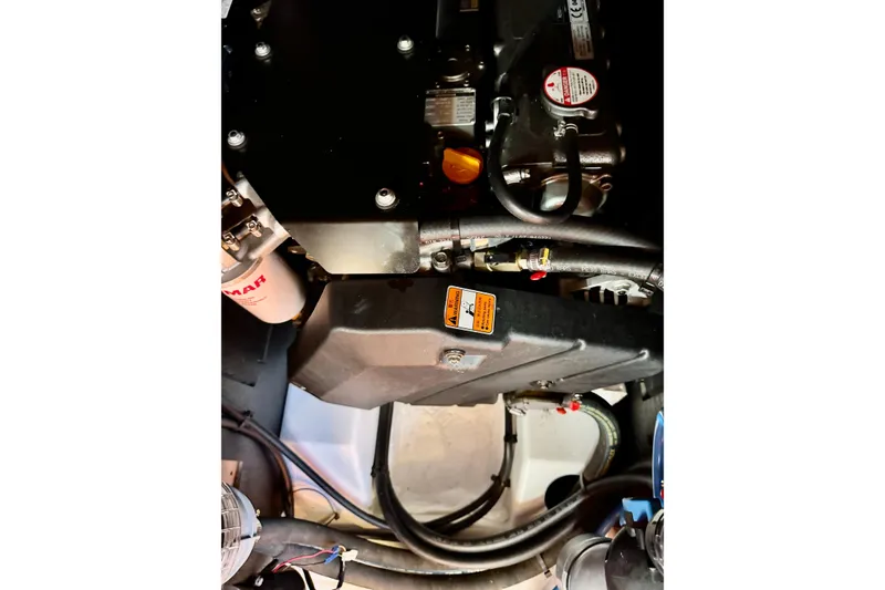 Slide: The Image of Engine compartment of 2019 Beneteau Oceanis 41.1 sailboat, featuring Yanmar components. - 58