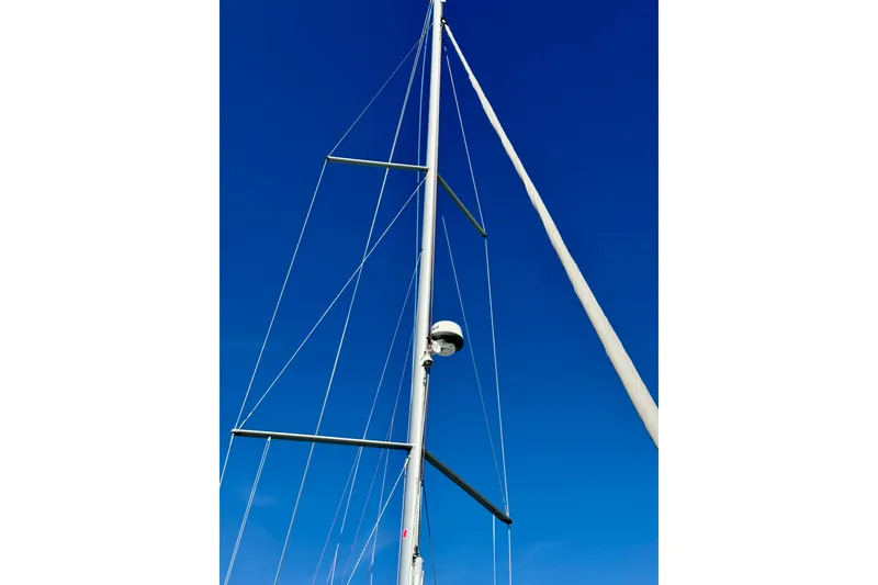 Slide: The Image of Mast of 2019 Beneteau Oceanis 41.1 sailboat against clear blue sky. - 6