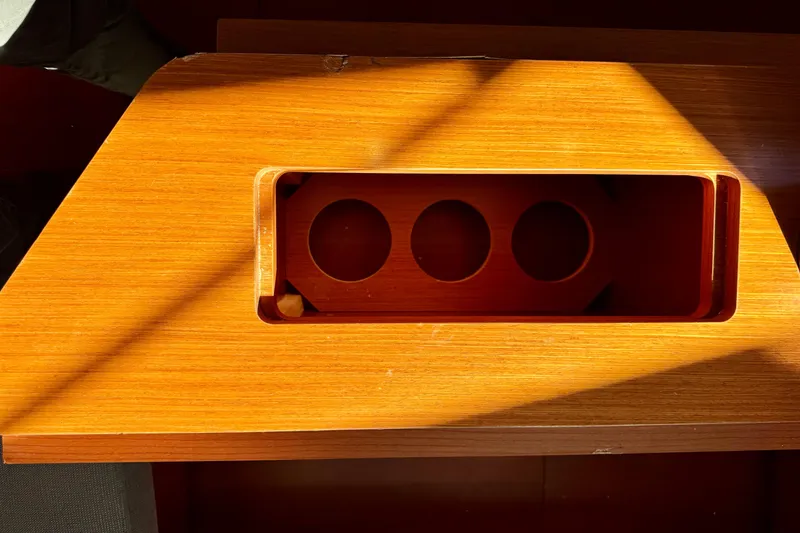 Slide: The Image of Wooden interior detail of a 2019 Beneteau Oceanis 41.1 yacht, featuring cup holders. - 60