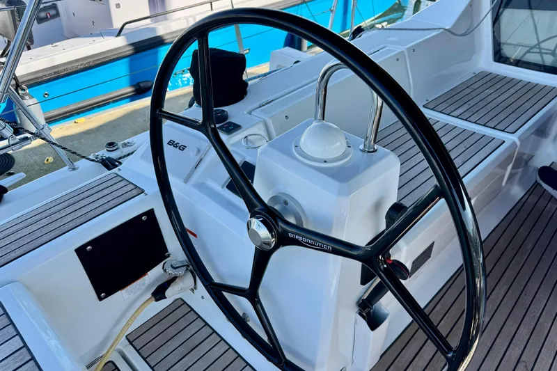 Slide: The Image of Steering wheel of 2019 Beneteau Oceanis 41.1 sailboat with teak decking. - 8