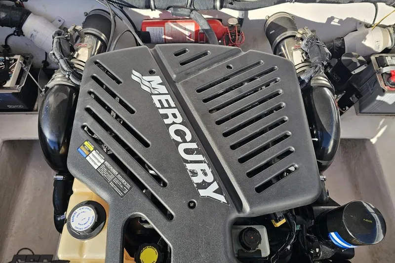 Slide: The Image of Engine compartment of a 2008 Donzi 27 ZR boat featuring a Mercury engine. - 106
