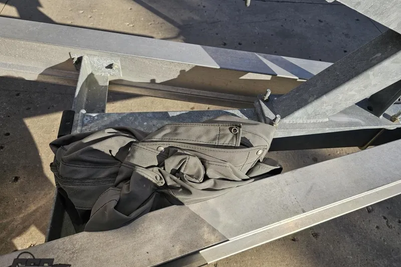 Slide: The Image of Gray fabric bag on metal frame, possibly part of a 2008 Donzi 27 ZR boat trailer. - 21