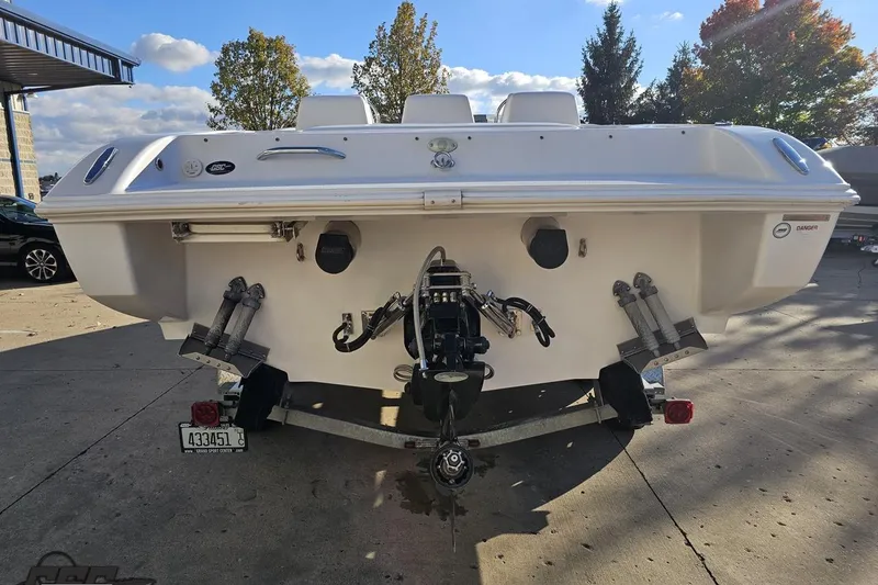Slide: The Image of Rear view of a 2008 Donzi 27 ZR boat on a trailer, outdoors. - 34