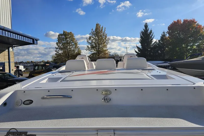 Slide: The Image of 2008 Donzi 27 ZR boat with sleek design, parked outdoors under a clear blue sky. - 39