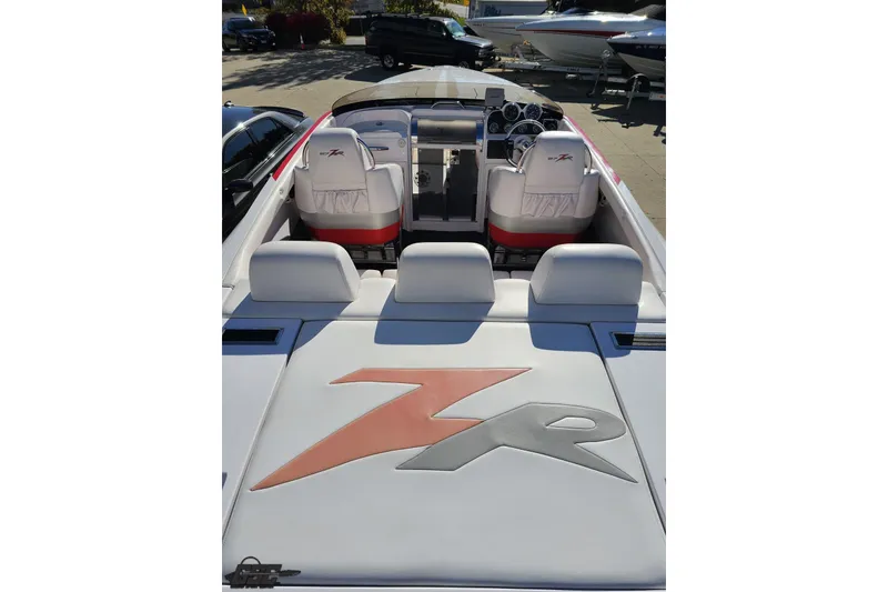 Slide: The Image of 2008 Donzi 27 ZR boat interior with sleek white seating and dashboard. - 45