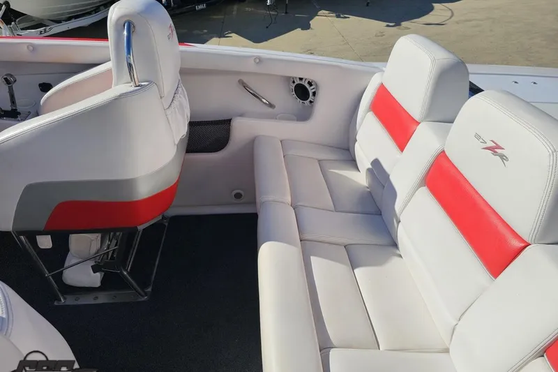 Slide: The Image of 2008 Donzi 27 ZR boat interior with white and red seating, showcasing sleek design. - 51