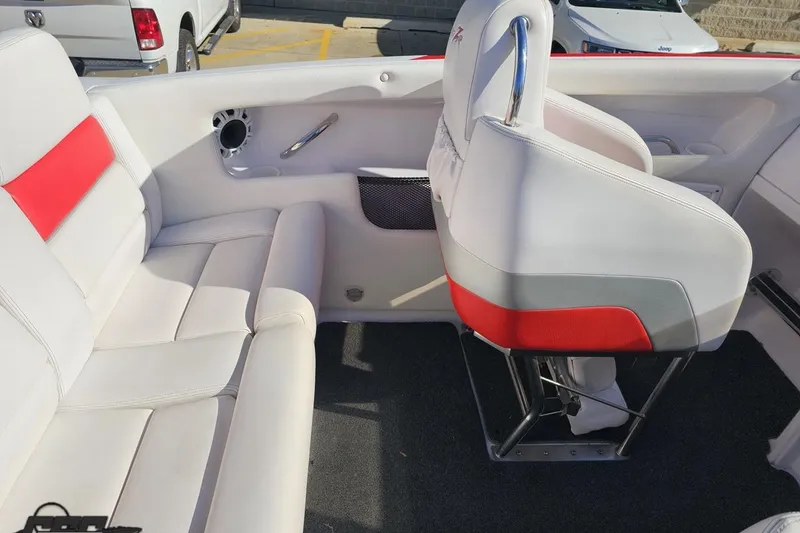 Slide: The Image of 2008 Donzi 27 ZR boat interior with white and red seating, showcasing modern design. - 54