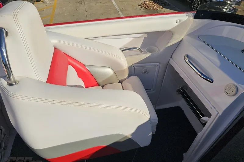 Slide: The Image of 2008 Donzi 27 ZR boat interior with white and red seating, sleek design. - 58