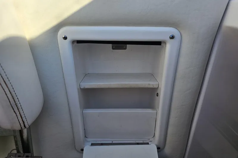 Slide: The Image of Storage compartment on a 2008 Donzi 27 ZR boat interior. - 60
