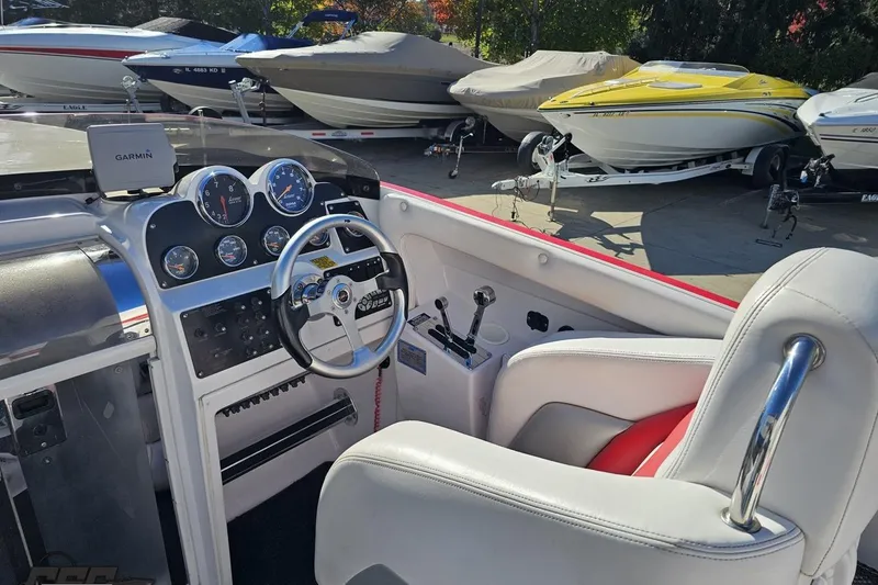 Slide: The Image of Interior of a 2008 Donzi 27 ZR boat with steering wheel and dashboard. - 62