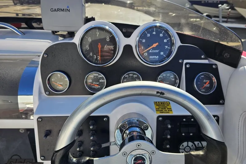 Slide: The Image of Dashboard of a 2008 Donzi 27 ZR boat with Garmin navigation system. - 64