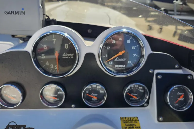 Slide: The Image of Dashboard of a 2008 Donzi 27 ZR boat with Livorsi gauges and Garmin device. - 65