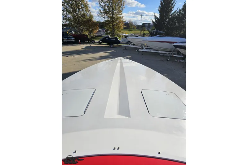 Slide: The Image of 2008 Donzi 27 ZR boat on trailer, viewed from bow, in outdoor storage area. - 67
