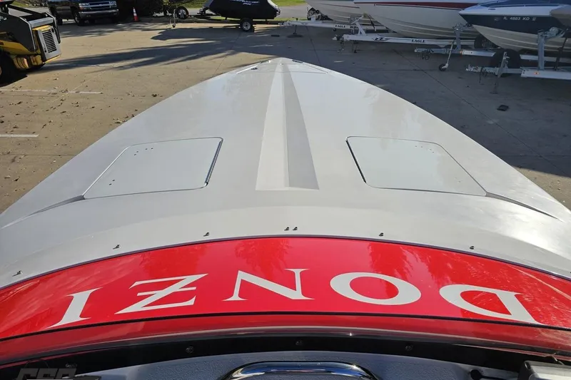 Slide: The Image of 2008 Donzi 27 ZR boat, top view, showcasing sleek design and vibrant red branding. - 68
