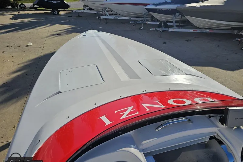 Slide: The Image of 2008 Donzi 27 ZR boat on trailer, sleek design with red detailing. - 69
