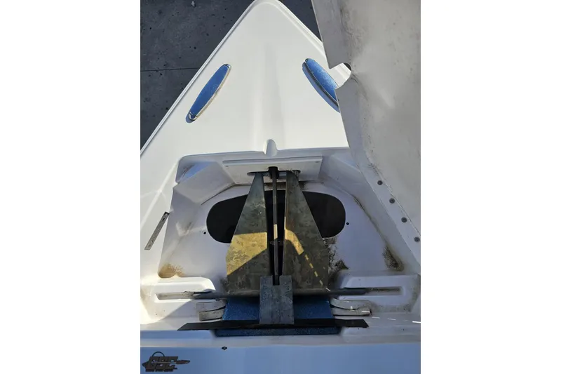 Slide: The Image of 2008 Donzi 27 ZR boat anchor compartment with stainless steel fittings. - 72