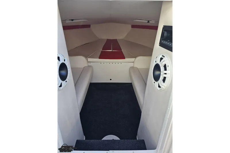 Slide: The Image of 2008 Donzi 27 ZR cabin interior with seating and audio system. - 76