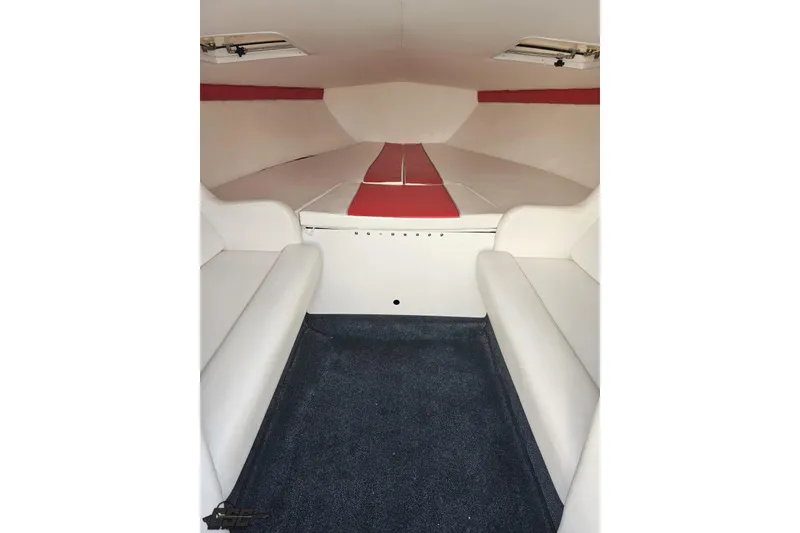 Slide: The Image of Interior cabin of a 2008 Donzi 27 ZR boat with white and red seating. - 77