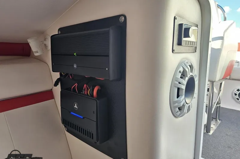 Slide: The Image of Interior of a 2008 Donzi 27 ZR boat featuring audio equipment and speaker system. - 80