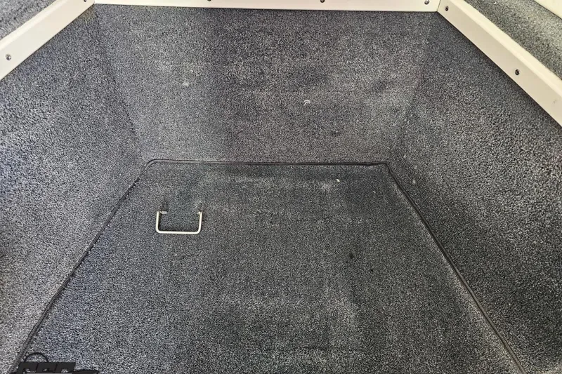 Slide: The Image of Carpeted storage compartment in a 2008 Donzi 27 ZR boat. - 83