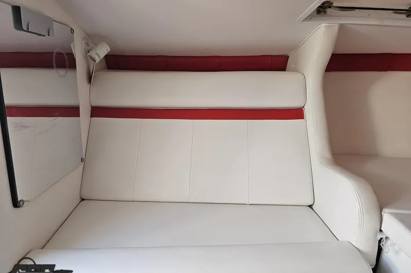 Slide: The Image of Interior of a 2008 Donzi 27 ZR boat with white and red seating. - 84