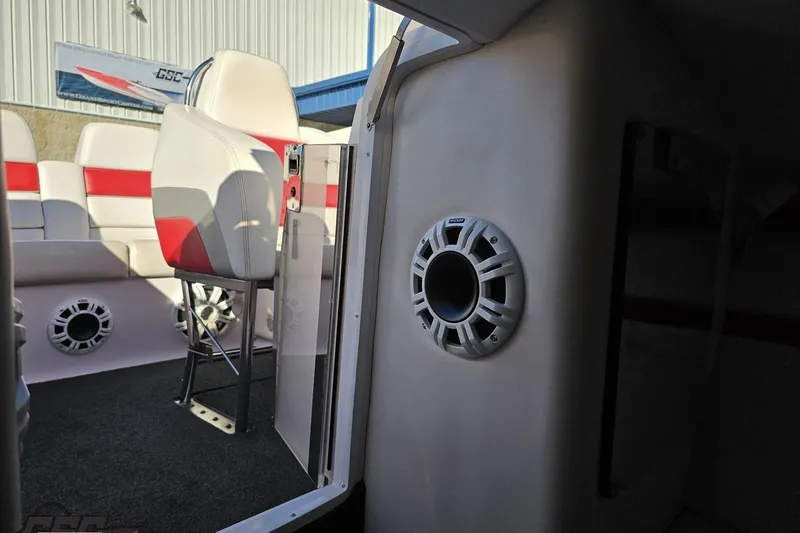 Slide: The Image of Interior of 2008 Donzi 27 ZR boat with red and white seating and speaker system. - 87