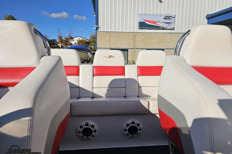 Slide: The Image of Interior of a 2008 Donzi 27 ZR boat with red and white seating. - 89