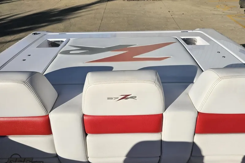 Slide: The Image of 2008 Donzi 27 ZR boat interior with white and red seating, logo visible. - 96