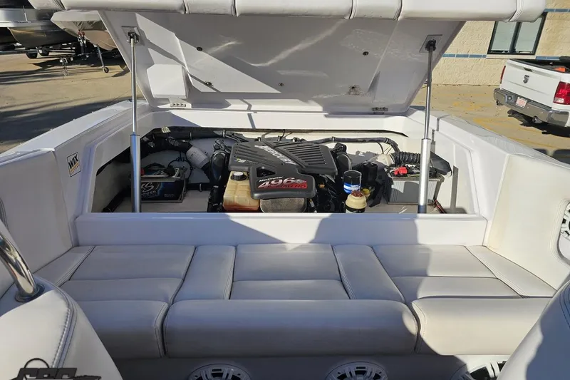 Slide: The Image of 2008 Donzi 27 ZR boat engine compartment with open hatch, showcasing powerful engine. - 98