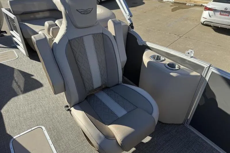 Slide: The Image of 2025 Bennington 26 MFB-SPS boat interior with luxurious seating and cup holders. - 16