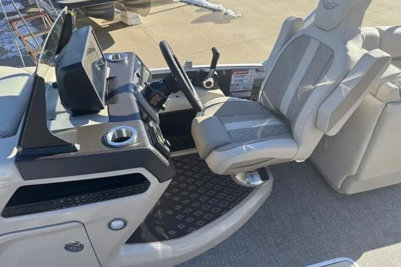 Slide: The Image of 2025 Bennington 26 MFB-SPS boat interior with modern helm and comfortable seating. - 17