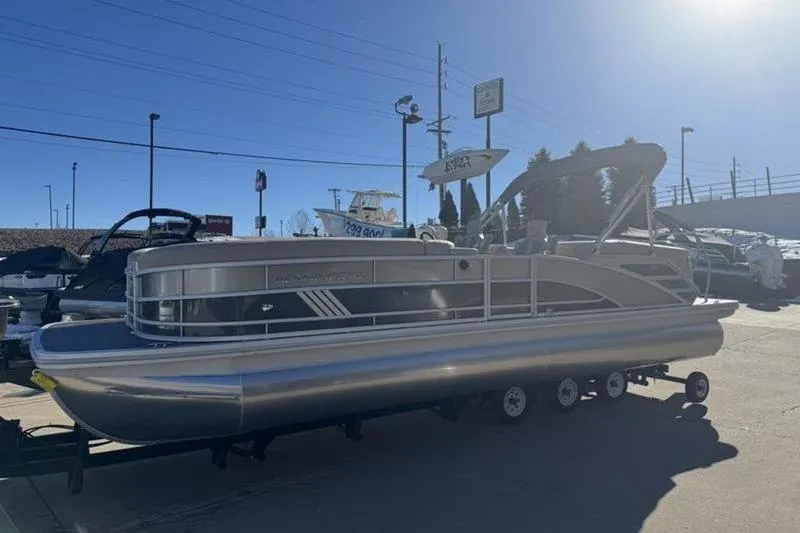 Slide: The Image of 2025 Bennington 26 MFB-SPS pontoon boat on trailer in outdoor showroom. - 22