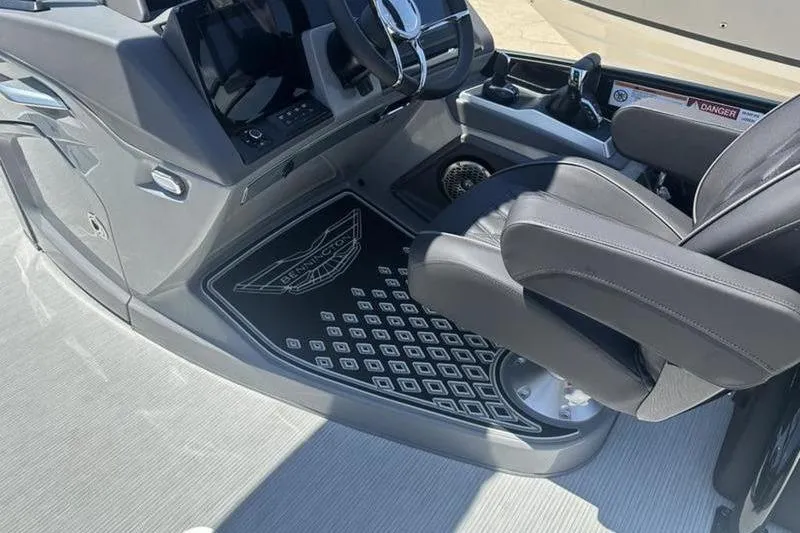 Slide: The Image of Interior of 2026 Bennington 30 QSBAX boat, featuring sleek helm and comfortable seating. - 6