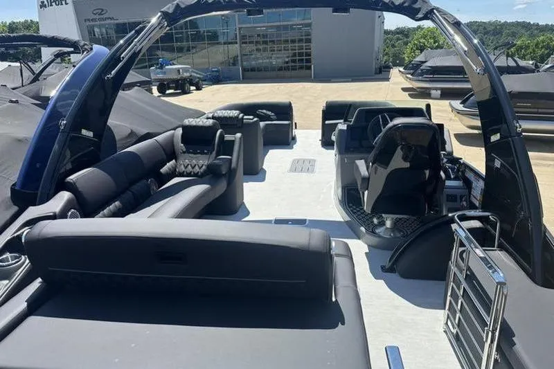 Slide: The Image of 2026 Bennington 30 QSBAX luxury pontoon boat interior with plush seating and modern helm. - 7