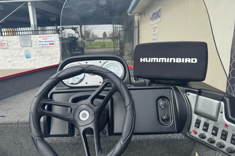 Slide: The Image of 2021 Lund 1650 Angler SS dashboard with Humminbird fish finder and steering wheel. - 12