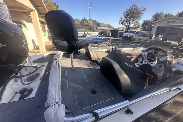 Slide: The Image of 2022 Tracker Pro Team 175 TXW boat interior with seating and control panel. - 2