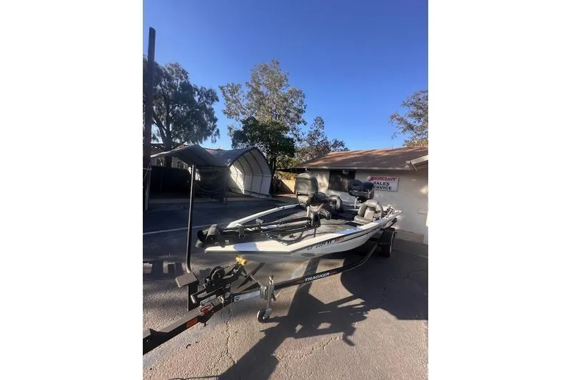Slide: The Image of 2022 Tracker Pro Team 175 TXW boat on trailer, parked outdoors. - 5