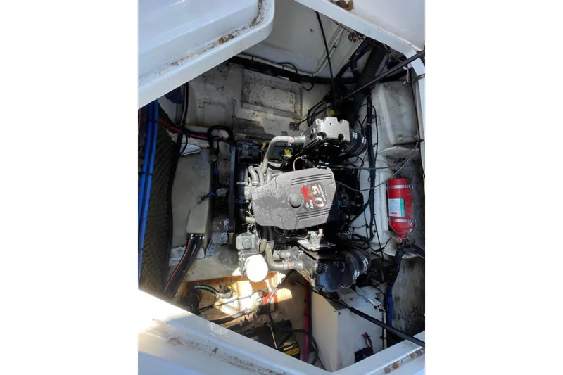 Slide: The Image of 2007 Sea Ray 240 Sundancer boat on trailer, parked in a marina. - 10