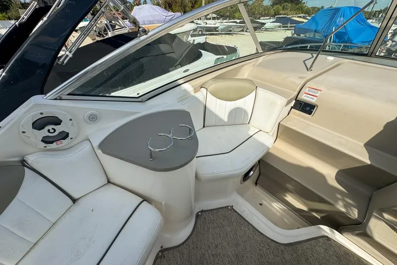 Slide: The Image of Interior of 2007 Sea Ray 240 Sundancer boat with seating and cup holders. - 110