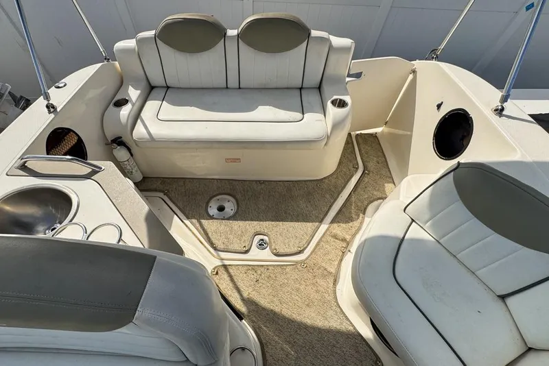 Slide: The Image of 2007 Sea Ray 240 Sundancer boat interior with seating and sink. - 112