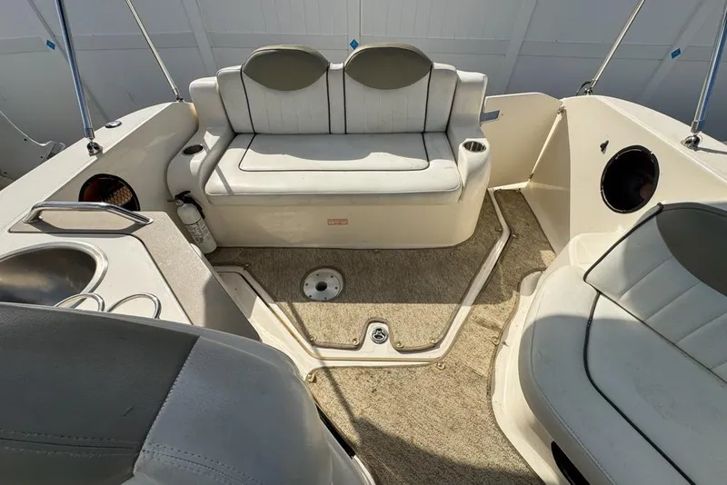 Slide: The Image of 2007 Sea Ray 240 Sundancer boat interior with seating and sink. - 113