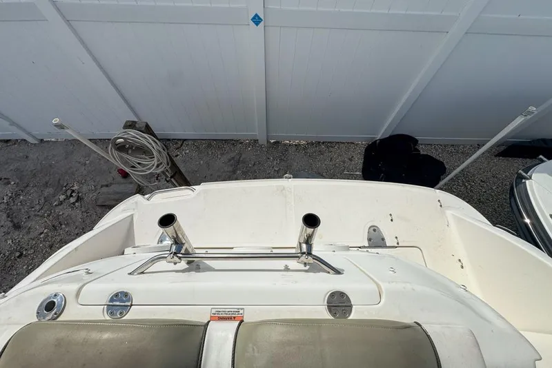 Slide: The Image of 2007 Sea Ray 240 Sundancer boat deck with rod holders, viewed from above. - 126
