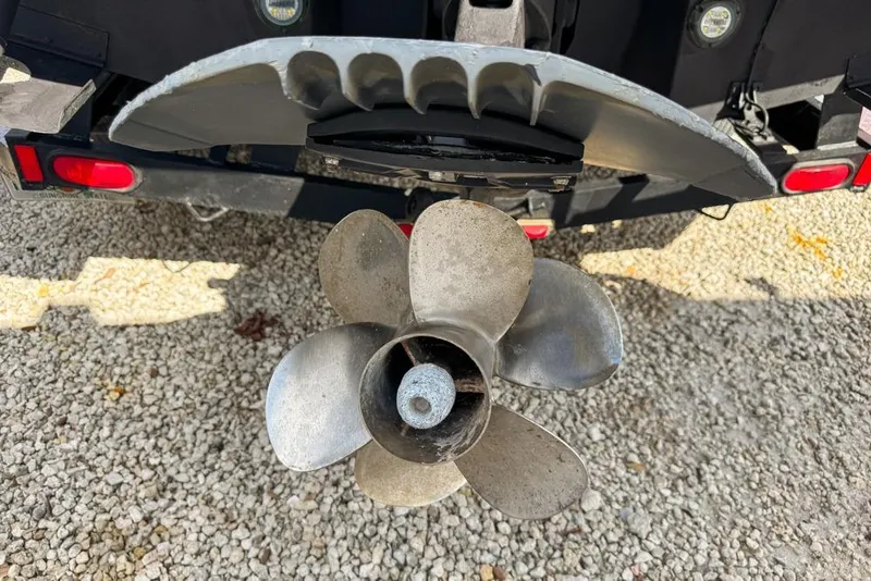 Slide: The Image of Propeller of 2007 Sea Ray 240 Sundancer boat on gravel surface. - 139