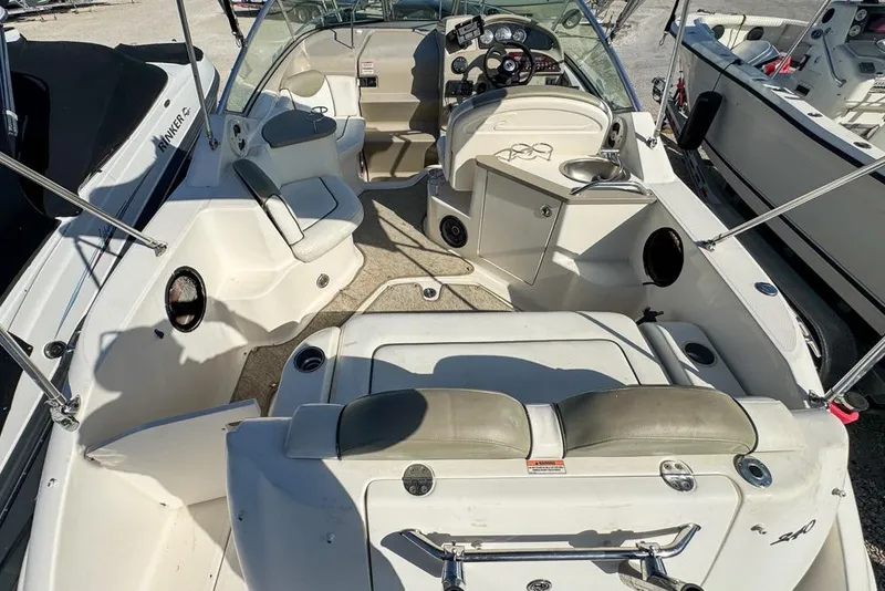 Slide: The Image of 2007 Sea Ray 240 Sundancer boat interior with seating, steering, and control panel. - 16
