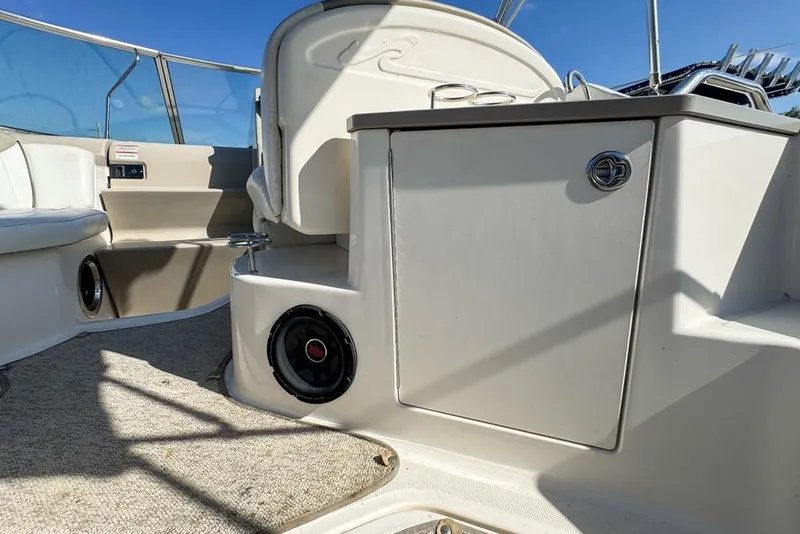 Slide: The Image of Interior view of 2007 Sea Ray 240 Sundancer boat, featuring seating and storage. - 28